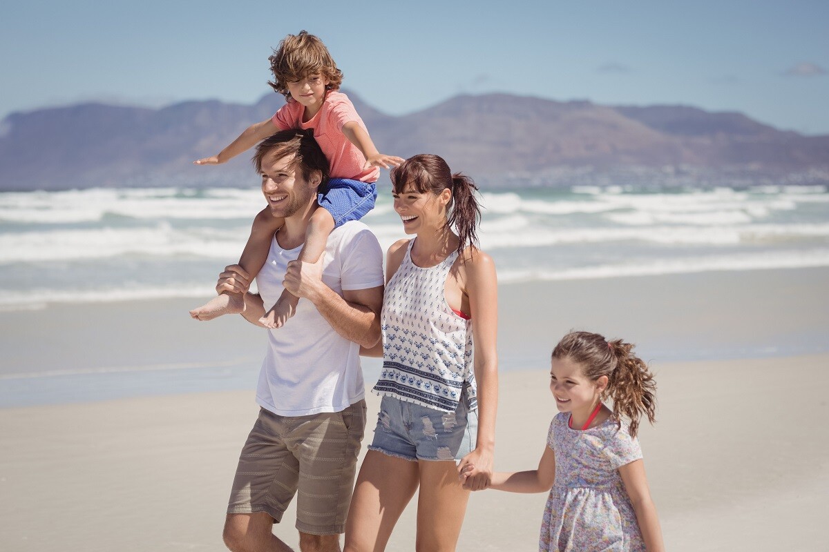 family walking on Pismo Beach