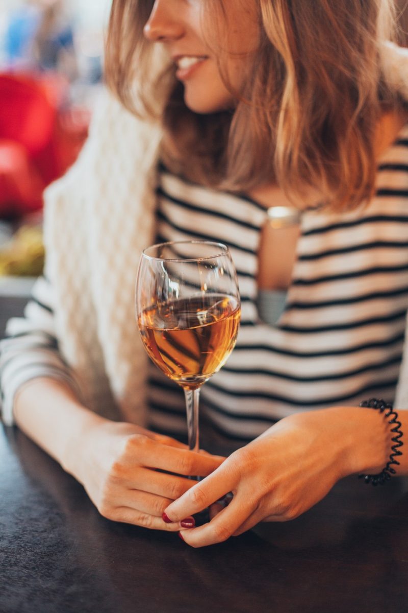 woman holding a glass of wine